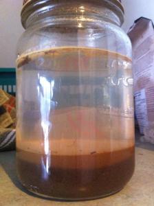 Jar test to determine levels of clay, silt, and sand in our building soil. Looks like we need to add some clay!