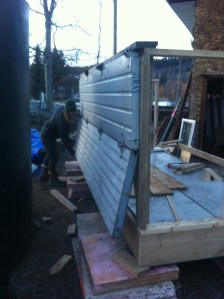 salvaged garage doors make an easy insulated wall